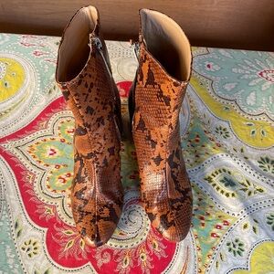 Urban Outfitters brown snake print style boots.